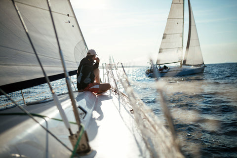 man relaxing on his sailboat